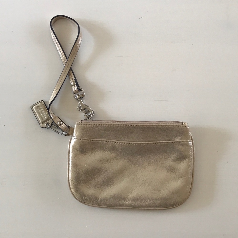 Coach shimmery gold wristlet never used!